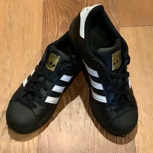 adidas Superstar Black Clamshell tennis shoes with gold accents Youth Size 4.5